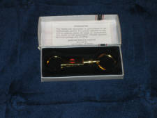 Clark key ring by Barlow, in brass, in original box.  [SOLD]