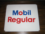 Mobil Regular 13.75 inches x 12 inches original porcelain pump plate, small knicks around bottom mounting holes, $325. 