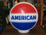 American gas globe, [American Oil Company, Troy, New York] on original wide milk glass 12.5 body, small, minor base nick on underside of glass body opening, $850. 
